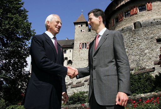 Prince Hans-Adam of Liechtenstein II (L) and his son Crown Prince Alois of Liechtenstein shake hands