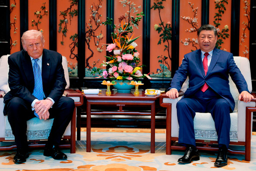 Donald Trump (t.v.) og Xi Jinping i Beijing fredag.
