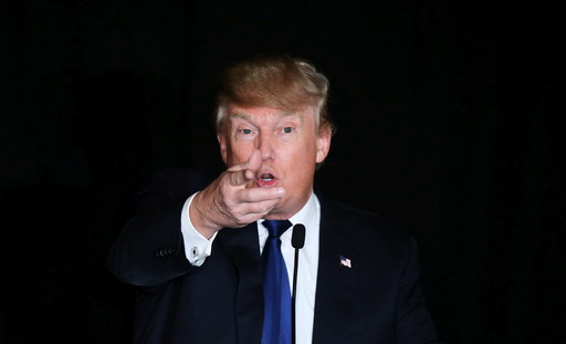 U.S. Republican presidential candidate Donald Trump gestures as he speaks at the meeting of the New England Police Benevolent Association in Portsmouth
