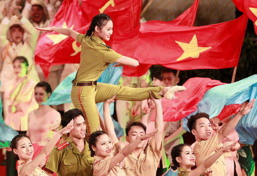 People perform during celebrations to commemorate 70th anniversary of establishment of Vietnam Public Security police force at National Convention Center in Hanoi
