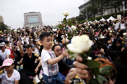 Supporters of the death penalty display white roses during a rally in front of Presidential Office in Taipei