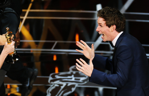 Actor Redmayne reacts as he takes the stage to accept the Oscar for best actor for his role in 