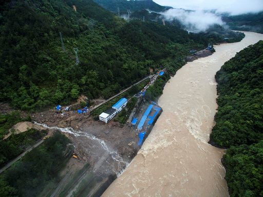 An aerial view shows buildings at a hydroelectric power station under construction are hit by landslide in Sanming