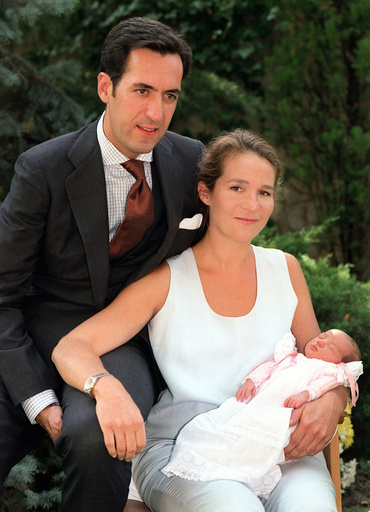 SPAIN'S INFANTA ELENA AND HER HUSBAND POSE WITH THEIR NEWBORN DAUGHTER