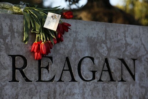Flowers are placed on a sign at The Ronald Reagan Presidential Library in honor of former First Lady Nancy Reagan, who died at the age of 94, in Simi Valley, California