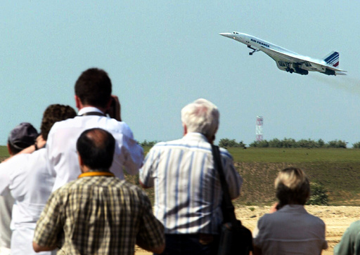PLANE SPOTTERS WATCH THE LAST AIR FRANCE CONCORDE TAKING OFF FROM PARIS'S ROISSY AIRPORT