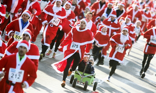 Runners dressed as Father Christmas participate in the Nikolaus Lauf (Santa Claus Run) in the east German town of Michendorf, southwest of Berlin