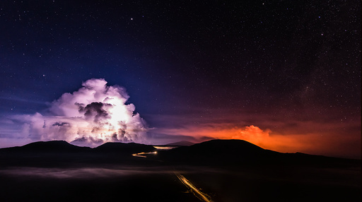 A long time exposure shows molten lava which flows from the Piton de la Fournaise, one of the world's most active volcanoes, on the French Indian Ocean Reunion Island