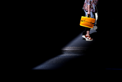 A shopper carries a bag as she walks through the CBD in Sydney