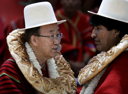 U.N. Secretary-General Ban Ki-moon talks with Bolivia's President Evo Morales during the inauguration of a sports arena called 