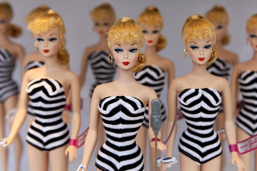 Barbie dolls sit on a display before the Barbie house opening ceremony in Shanghai