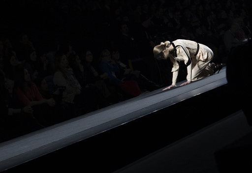 A model falls as she presents a creation from designer Miguel Palacio's Fall/Winter 2012 collection during the Mercedes-Benz Fashion Week in Madrid