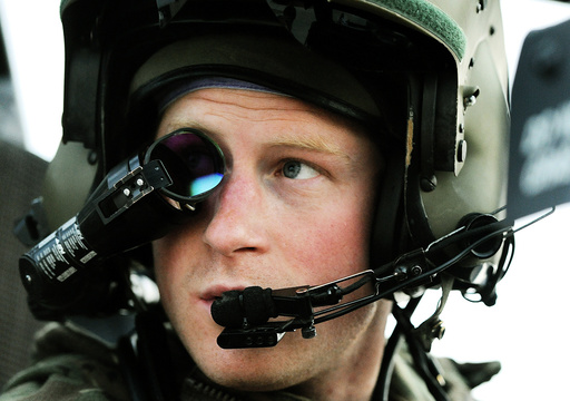 Britain's Prince Harry wears his monocle gun sight as he sits in his Apache helicopter at Camp Bastion, southern Afghanistan