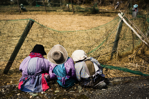 Scarecrows sit in at edge of a field in mountain village of Nagoro