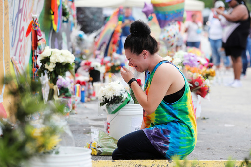 Nylen reacts while visiting the memorial outside the Pulse Nightclub on the one-year anniversary of the shooting in Orlando