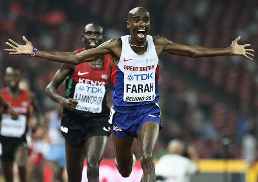 Farah of Britain reacts after winning the men's 10000m event during the 15th IAAF World Championships at the National Stadium in Beijing