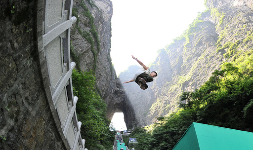 Contestant takes part in a parkour competition at Tianmen mountain, in Zhangjiajie, Hunan
