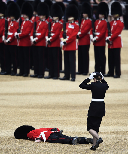 A Guardsman faints at Horseguards Parade for the annual Trooping the Colour ceremony in central London