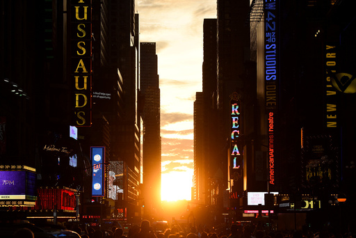 The sun sets over Manhattan, aligned exactly with the streets in a phenomenon known as Manhattanhenge