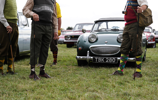 Visitors and car enthusiasts attend the annual Goodwood Revival historic motor racing festival, celebrating a mid-twentieth century heyday of the racing circuit, near Chichester in south England