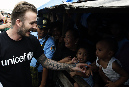 David Beckham greets victims of super Typhoon Haiyan at an evacuation centre in Tacloban city in central Philippines