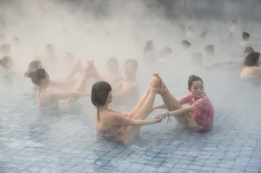 Women practise yoga at a hot spring in Luoyang