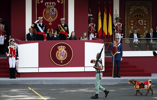 A goat, the mascot of Spanish legionnaires, parades past Spanish King Felipe, Spanish Queen Letizia and their daughters Princess Leonor and Princess Sofia during a military parade marking Spain's National Day in Madrid