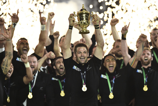 Richie McCaw of New Zealand holds up the Webb Ellis Cup after winning the Rugby World Cup Final against Australia at Twickenham in London