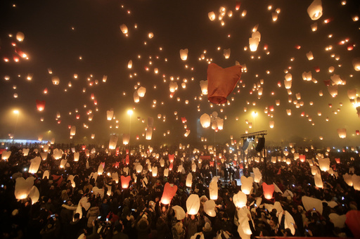 Participants release sky lanterns during the Christmas light of wishes event in Zagreb