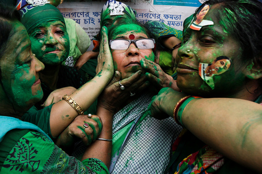 Supporters of TMC celebrate after learning the initial poll results of the West Bengal Assembly elections, in Kolkata
