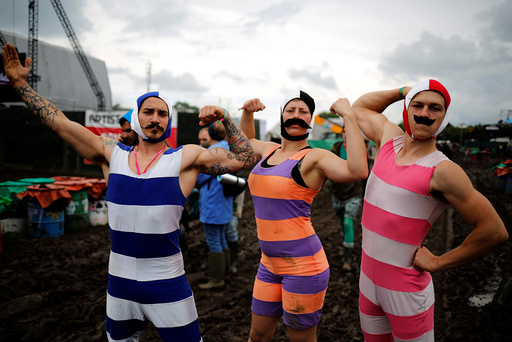 Revellers pose for a picture at Worthy Farm in Somerset during the Glastonbury Festival