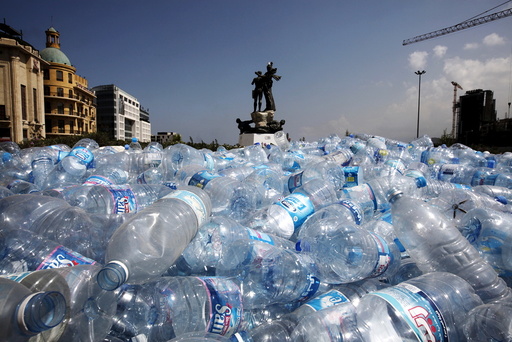 Water bottles are gathered to be recycled near a statue in Martyrs' Square in Beirut, Lebanon