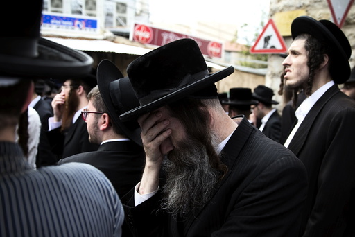 An Ultra-Orthodox Jewish man mourns during the funeral of Yeshayahu Krishevsky in Jerusalem's Mea Shearim neighbourhood