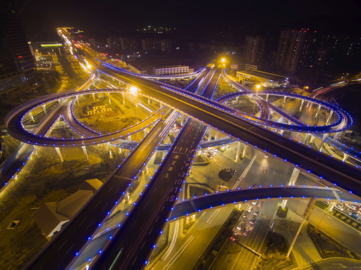 Overpass lighted in blue is seen during a hazy day in Jinan