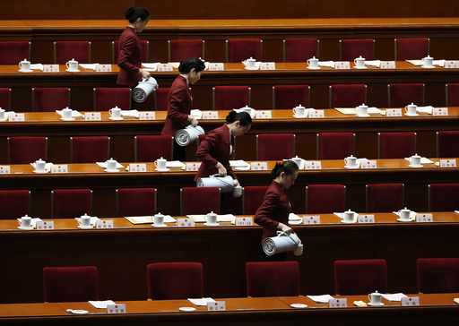 Attendants prepare tea inside the Great Hall of the People ahead of the second plenary session of the National People's Congress in Beijing
