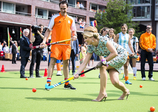 Queen Maxima of the Netherlands participates in a game of hockey during the first King's Day in Amstelveen