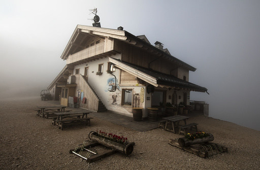 The Rifugio Averau is seen shrouded in fog near Cortina d' Ampezzo in northern Italy