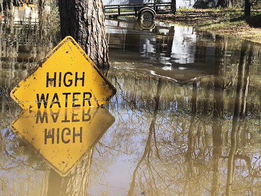 A high water sign is submerged near Lake Bistineau in Webster Parish Louisiana