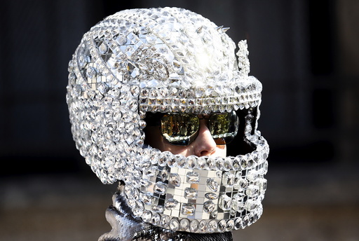 A person wears an helmet as advertising creation during the Spring/Summer 2016 collections at the Milan Fashion Week
