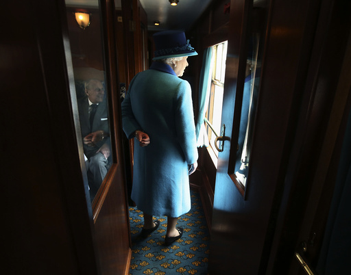 Britain's Queen Elizabeth boards her carriage as she travels on the new Scottish Borders railway line, in Scotland