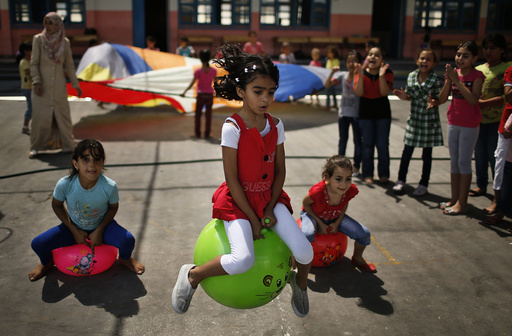 Palestinian girls play during U.N.-run summer fun games week in Gaza City