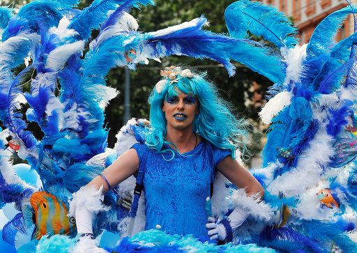 A reveller participates in Regenbogenparade gay pride parade in Vienna