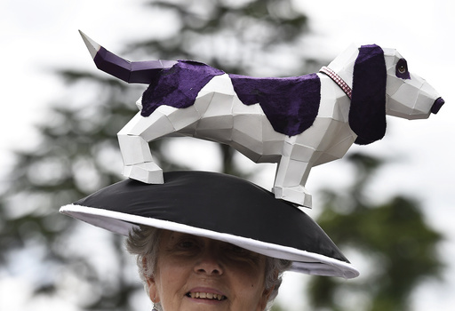 Britain Horse Racing Ladies Day Racegoer wears hat