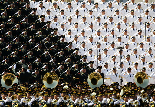 Military band sing and salute at the Tiananmen Square at the beginning of the military parade marking the 70th anniversary of the end of World War Two, in Beijing