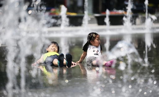 Children play in a fountain in South Korea