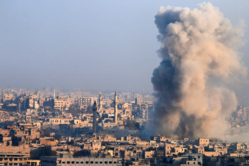 Smoke rises as seen from a rebel-held area of Aleppo