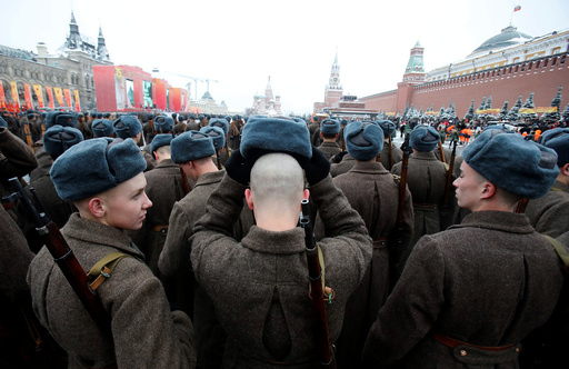 Servicemen dressed in historical uniforms wait before military parade marking anniversary of 1941 parade in Red Square in Moscow