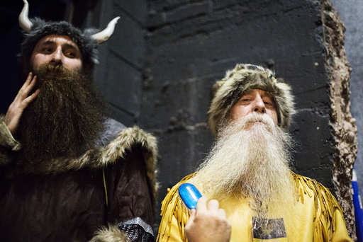 Contestants groom their beards backstage at the 2015 Just For Men National Beard & Moustache Championships at the Kings Theater in the Brooklyn borough of New York