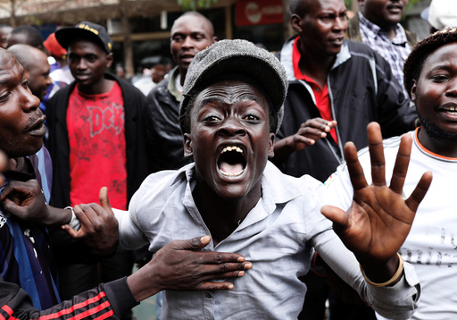 Supporters of Kenyan President Uhuru Kenyatta shout in front of Supreme Court in Nairobi