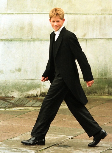 Prince Harry walks from his dormitory to begin his first day of lessons at England's elite school Et..